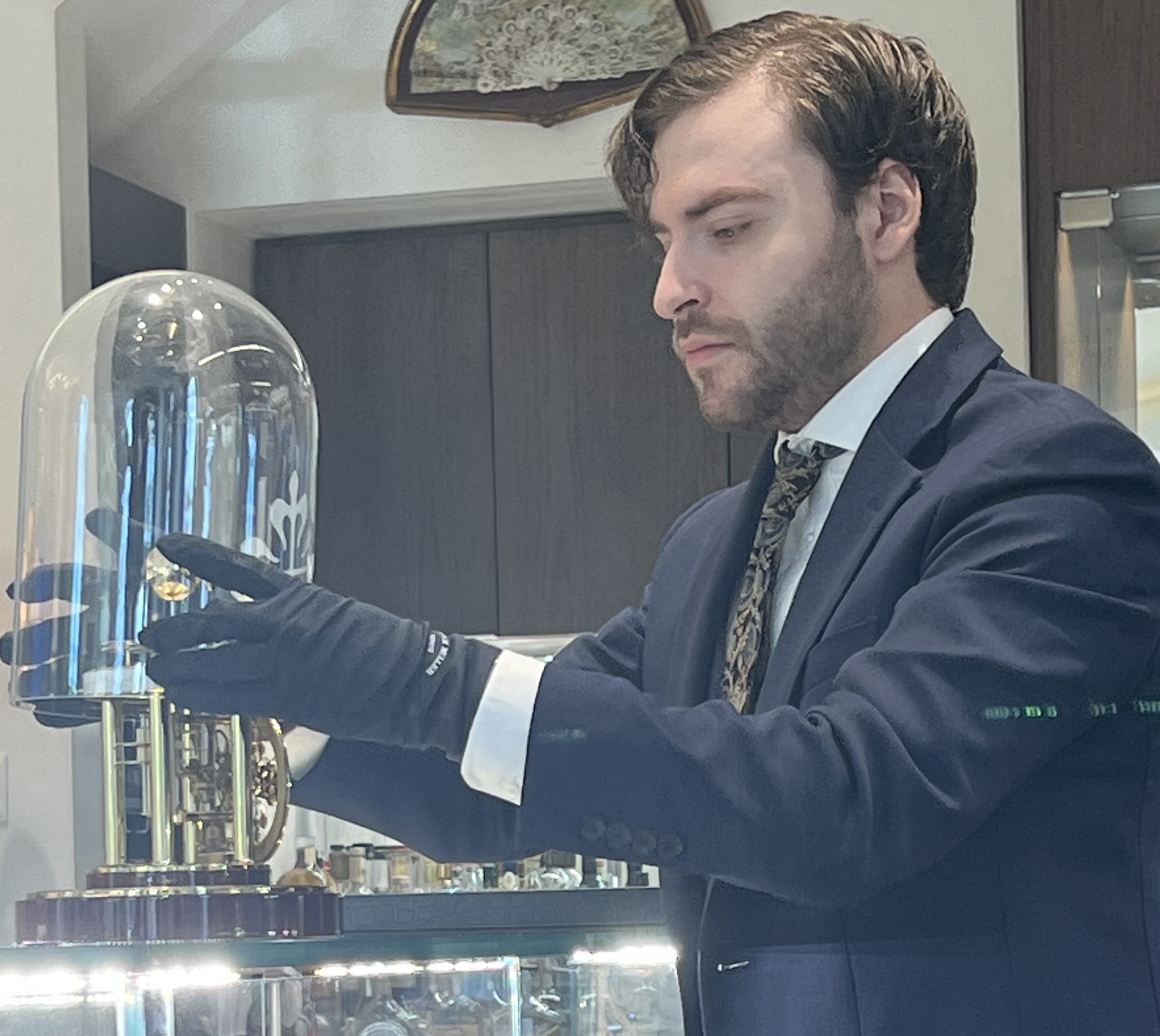 Tariq examining a fine timepiece at Time of Tariq